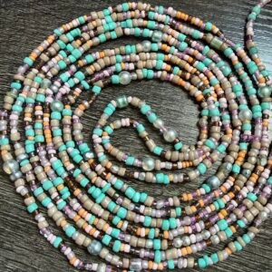 Desert Mermaid handmade waistbeads featuring turquoise, beige, lavender, and peach tones with a boho mermaid aesthetic